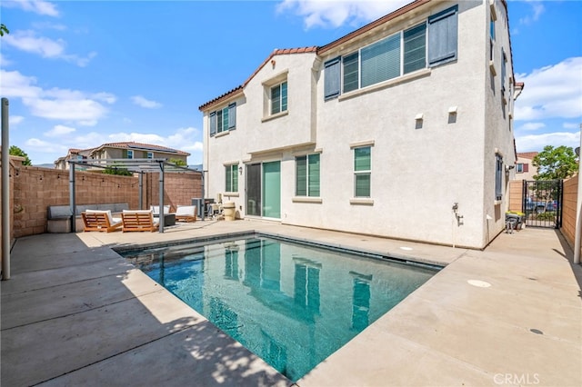 4360 Rima Dr, Fontana, CA 92336 - view of swimming pool with a patio, a fenced backyard, an outdoor hangout area, and a gate