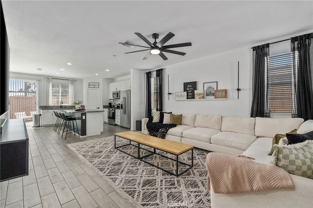 4360 Rima Dr, Fontana, CA 92336 - living area with a ceiling fan, recessed lighting, and light wood finished floors