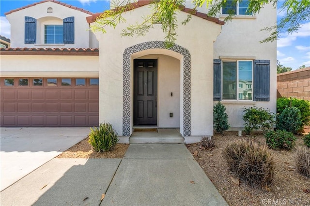 4360 Rima Dr, Fontana, CA 92336 - mediterranean / spanish-style house with stucco siding, driveway, and a tiled roof