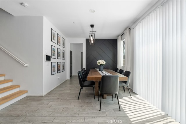 4360 Rima Dr, Fontana, CA 92336 - dining area with light wood-type flooring and stairway
