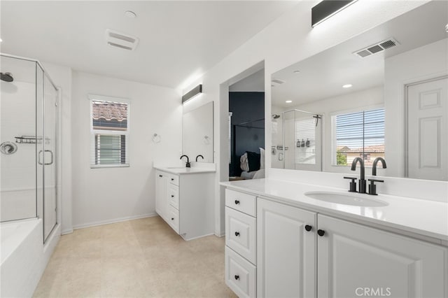 4360 Rima Dr, Fontana, CA 92336 - full bathroom with a stall shower, plenty of natural light, and two vanities