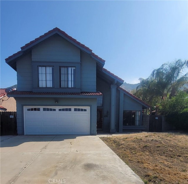 15681 Half Moon Dr, Lake Elsinore, CA 92530 - view of front of property featuring a tile roof, a garage, and driveway