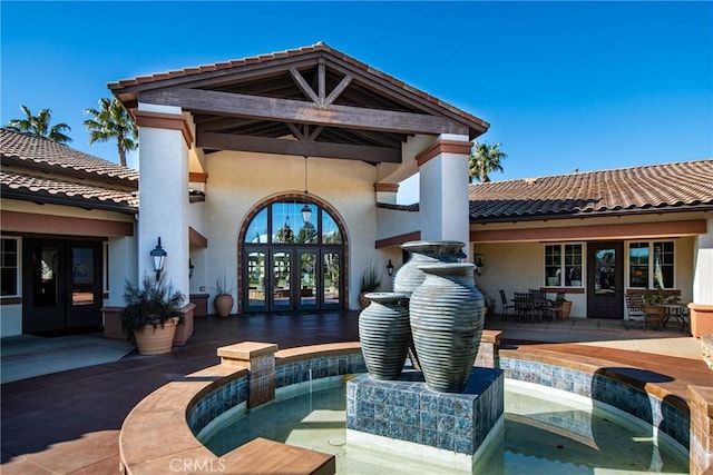1544 Big Bnd, Beaumont, CA 92223 - rear view of property with french doors, stucco siding, a tile roof, and a patio area