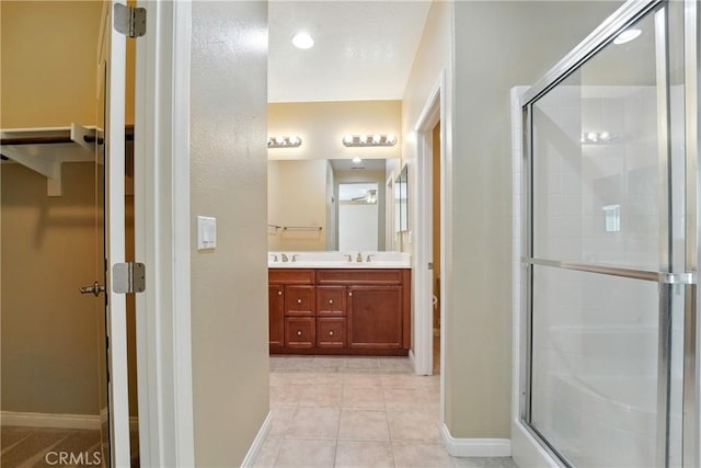 1544 Big Bnd, Beaumont, CA 92223 - full bath featuring double vanity, a stall shower, and tile patterned floors