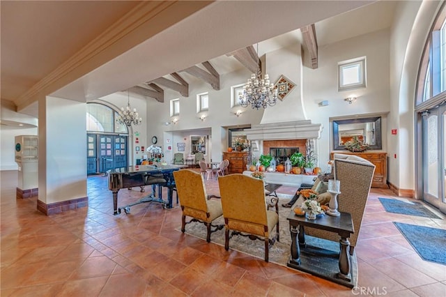1544 Big Bnd, Beaumont, CA 92223 - dining area with a chandelier, a high ceiling, beam ceiling, tile patterned floors, and a multi sided fireplace