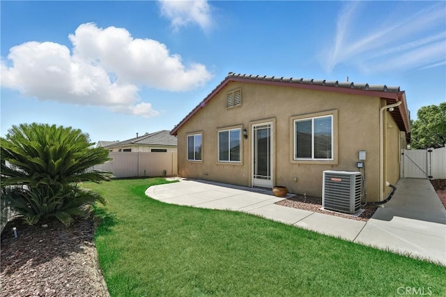 1544 Big Bnd, Beaumont, CA 92223 - back of house with a gate, stucco siding, and a patio