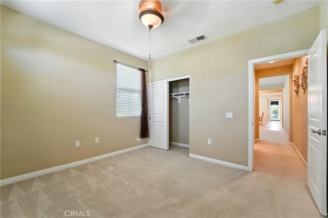 1544 Big Bnd, Beaumont, CA 92223 - unfurnished bedroom featuring light carpet, multiple windows, and a closet