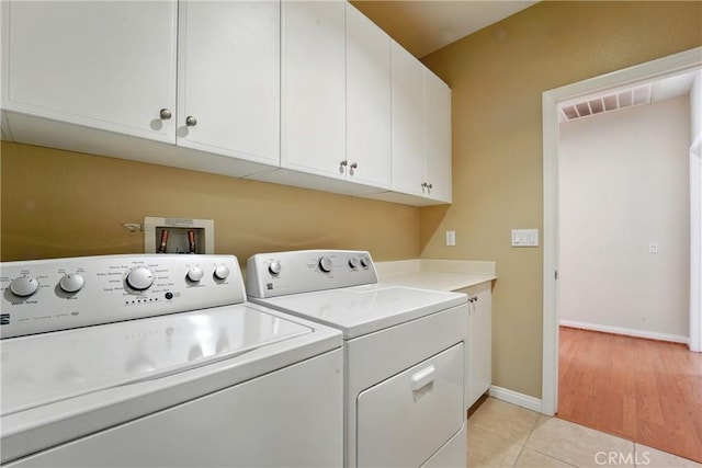 1544 Big Bnd, Beaumont, CA 92223 - laundry area with separate washer and dryer, cabinet space, and light tile patterned floors
