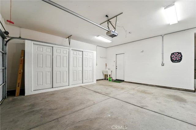 1544 Big Bnd, Beaumont, CA 92223 - garage with a garage door opener and a sink