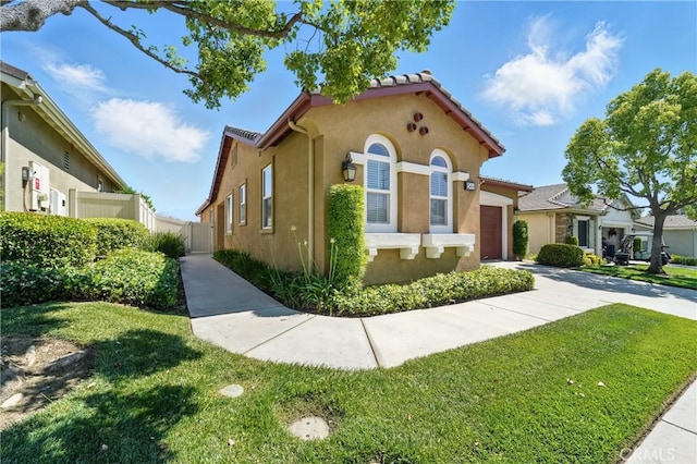 1544 Big Bnd, Beaumont, CA 92223 - mediterranean / spanish home with stucco siding, an attached garage, concrete driveway, and a tile roof