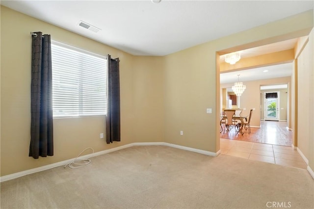 1544 Big Bnd, Beaumont, CA 92223 - unfurnished room featuring carpet, a chandelier, and tile patterned flooring