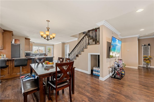 2730 Hayes Ave, Long Beach, CA 90810 - dining area with a chandelier, dark wood-type flooring, stairway, crown molding, and recessed lighting