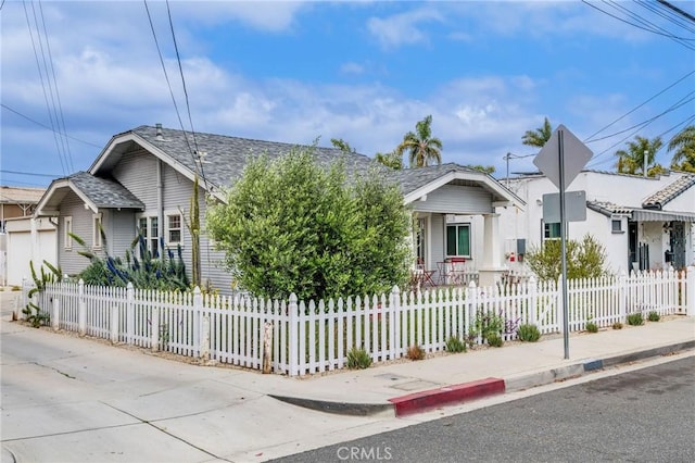 4115 E 10th St, Long Beach, CA 90804 - bungalow-style home featuring a fenced front yard and roof with shingles