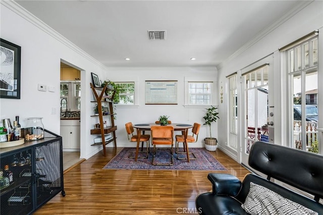 4115 E 10th St, Long Beach, CA 90804 - dining room with wood finished floors, ornamental molding, and recessed lighting
