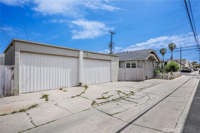 4115 E 10th St, Long Beach, CA 90804 - exterior space featuring an outdoor structure, a garage, and stucco siding