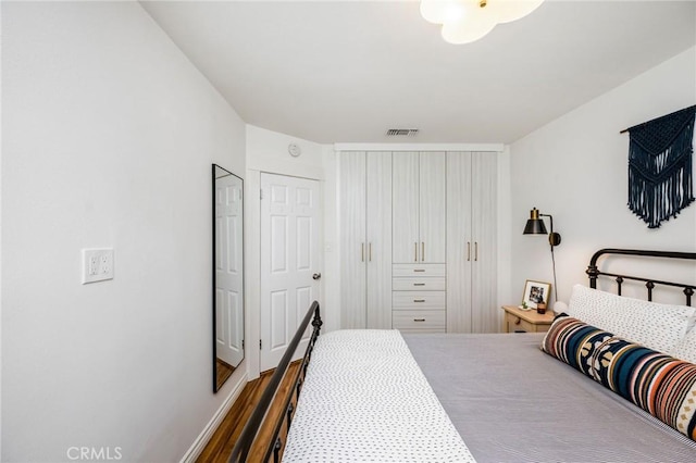 4115 E 10th St, Long Beach, CA 90804 - bedroom with wood finished floors and a closet