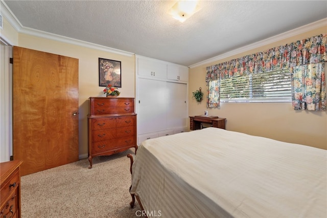 12429 Baker Ave, Chino, CA 91710 - bedroom with ornamental molding, a textured ceiling, carpet floors, and a closet