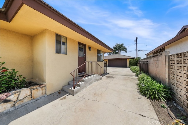 12429 Baker Ave, Chino, CA 91710 - view of patio with a garage and an outdoor structure