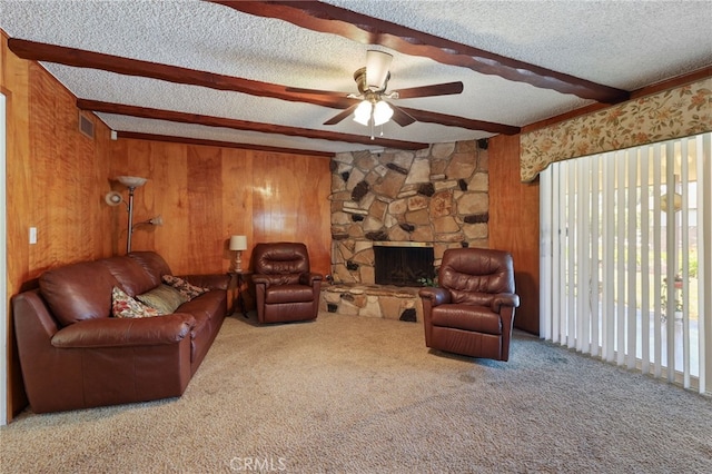 12429 Baker Ave, Chino, CA 91710 - living area with carpet floors, a ceiling fan, beamed ceiling, wood walls, and a textured ceiling