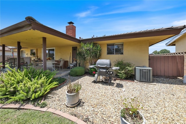 12429 Baker Ave, Chino, CA 91710 - back of house with stucco siding, a chimney, and a patio area
