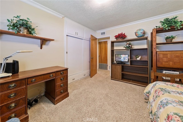 12429 Baker Ave, Chino, CA 91710 - bedroom with crown molding, a textured ceiling, a desk, light colored carpet, and a closet