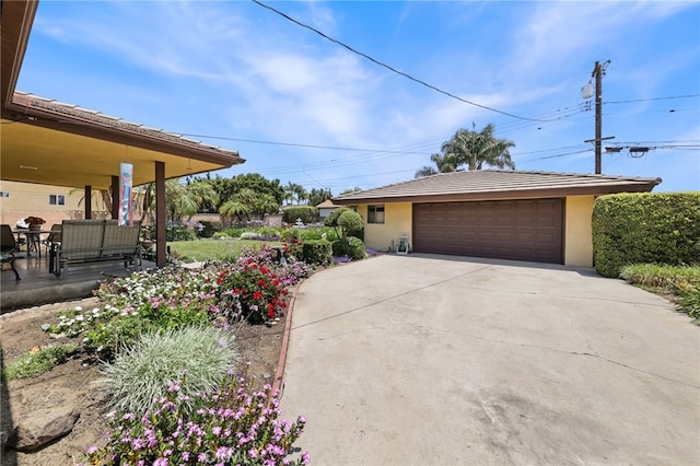 12429 Baker Ave, Chino, CA 91710 - view of home's exterior with stucco siding and a detached garage