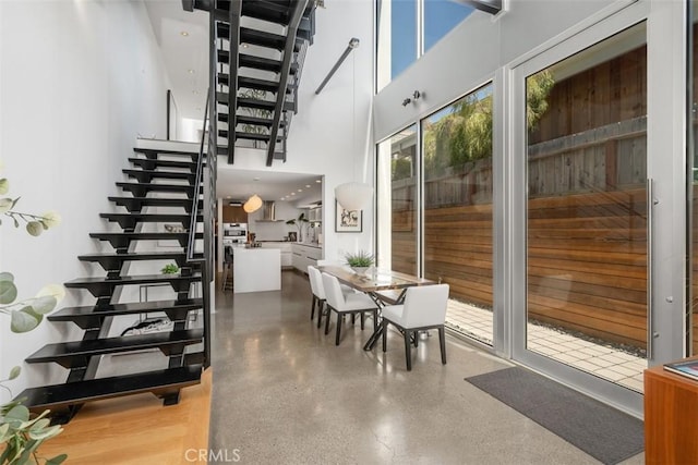 417 Sunset Ave Unit 1.2, Venice, CA 90291 - stairway with speckle patterned floor and a high ceiling