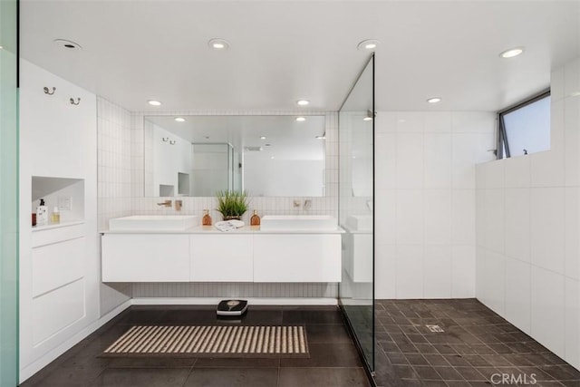 417 Sunset Ave Unit 1.2, Venice, CA 90291 - full bathroom featuring double vanity, a tile shower, tile walls, tile patterned flooring, and recessed lighting