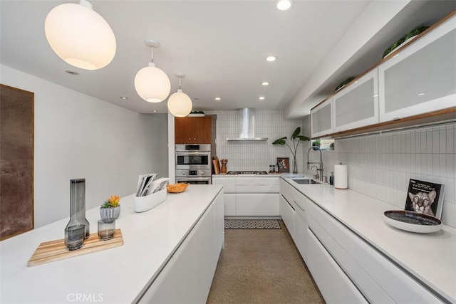 417 Sunset Ave Unit 1.2, Venice, CA 90291 - kitchen featuring wall chimney range hood, white gas stovetop, tasteful backsplash, white cabinets, and light countertops