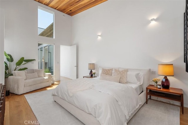 417 Sunset Ave Unit 1.2, Venice, CA 90291 - bedroom with wood ceiling, wood finished floors, and high vaulted ceiling