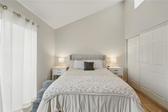 14861 Mulberry Dr Unit 1310, Whittier, CA 90604 - bedroom featuring light wood-style floors, a closet, and high vaulted ceiling