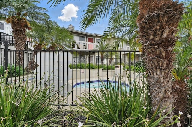 14861 Mulberry Dr Unit 1310, Whittier, CA 90604 - gate featuring a swimming pool