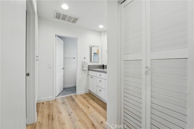 14861 Mulberry Dr Unit 1310, Whittier, CA 90604 - bathroom featuring vanity, wood finished floors, and recessed lighting