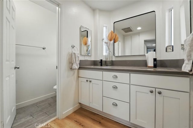 14861 Mulberry Dr Unit 1310, Whittier, CA 90604 - bathroom with double vanity and wood finished floors