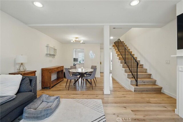 14861 Mulberry Dr Unit 1310, Whittier, CA 90604 - living room featuring stairs, light wood-style floors, and recessed lighting