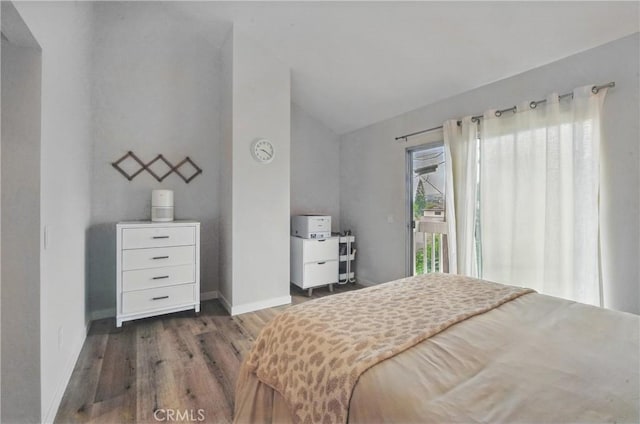 14861 Mulberry Dr Unit 1310, Whittier, CA 90604 - bedroom with lofted ceiling, wood finished floors, and access to exterior