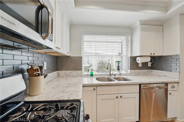 14861 Mulberry Dr Unit 1310, Whittier, CA 90604 - kitchen featuring stainless steel appliances, crown molding, white cabinets, and backsplash