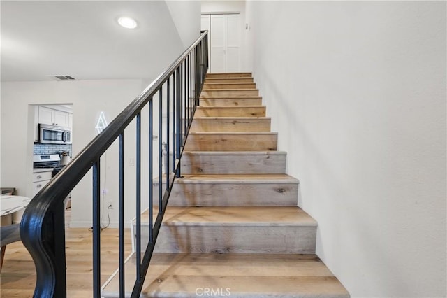 14861 Mulberry Dr Unit 1310, Whittier, CA 90604 - stairs featuring wood finished floors and recessed lighting