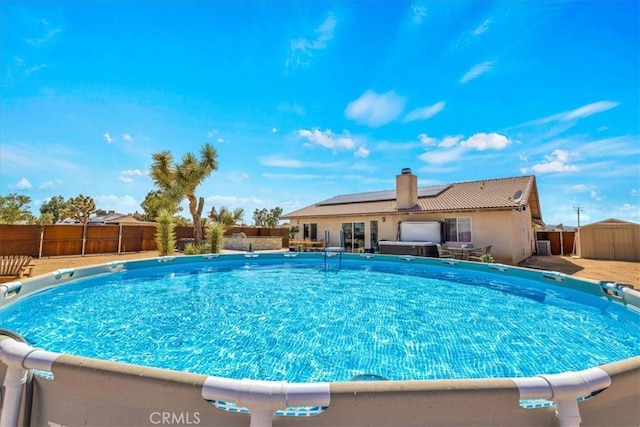 3715 Surrey, Yucca Valley, CA 92284 - view of pool featuring a storage shed and a fenced backyard