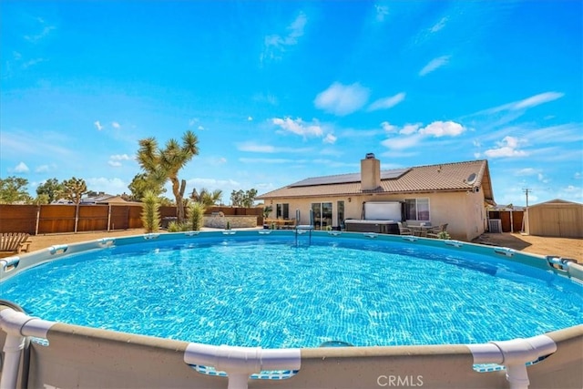 3715 Surrey, Yucca Valley, CA 92284 - view of pool featuring a storage shed and a fenced backyard