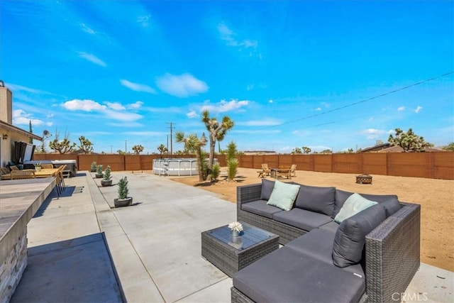 3715 Surrey, Yucca Valley, CA 92284 - fenced backyard with outdoor lounge area and a patio area
