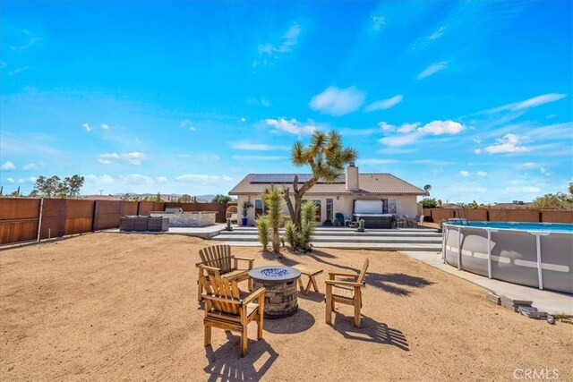 3715 Surrey, Yucca Valley, CA 92284 - fenced backyard with an outdoor fire pit and a patio