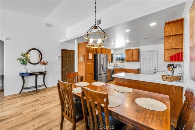 3715 Surrey, Yucca Valley, CA 92284 - dining space featuring light wood-type flooring, vaulted ceiling, and recessed lighting