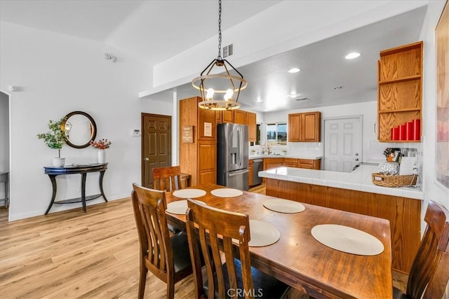 3715 Surrey, Yucca Valley, CA 92284 - dining room featuring light wood-style flooring, vaulted ceiling, and recessed lighting