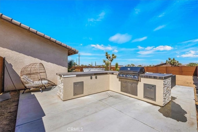3715 Surrey, Yucca Valley, CA 92284 - view of patio featuring exterior kitchen