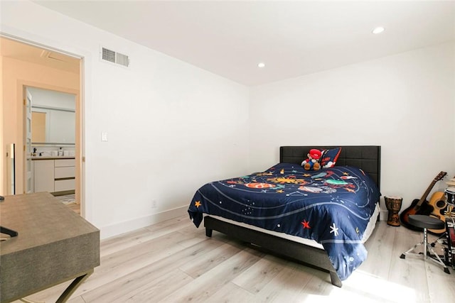 23500 Lloyd Houghton Pl, Newhall, CA 91321 - bedroom with wood finished floors and recessed lighting