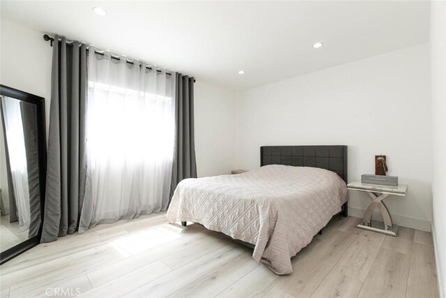 23500 Lloyd Houghton Pl, Newhall, CA 91321 - bedroom featuring light wood finished floors and recessed lighting