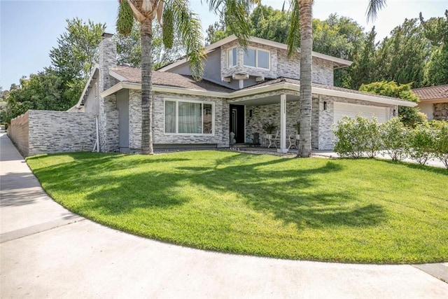 23500 Lloyd Houghton Pl, Newhall, CA 91321 - view of front of property featuring an attached garage, a front lawn, stone siding, and a chimney