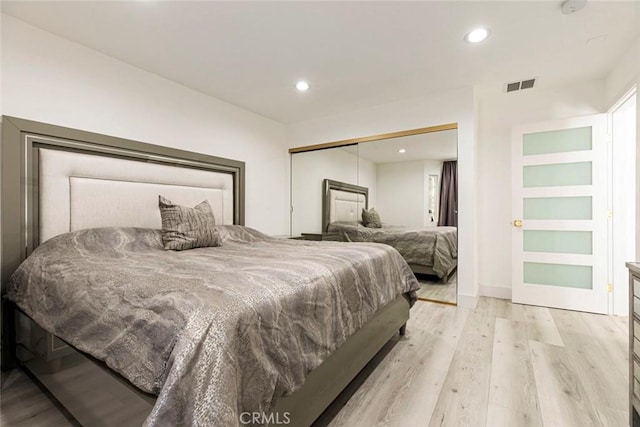 23500 Lloyd Houghton Pl, Newhall, CA 91321 - bedroom with light wood-style flooring, recessed lighting, and a closet