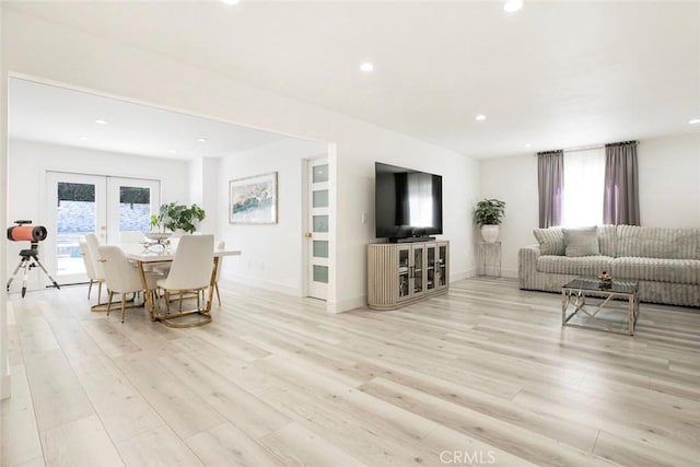 23500 Lloyd Houghton Pl, Newhall, CA 91321 - living area with recessed lighting, light wood-style flooring, and french doors